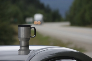 coffee tumbler on the roof of car