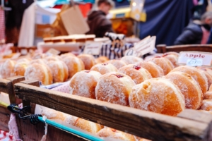 jelly filled donuts in a bakery case